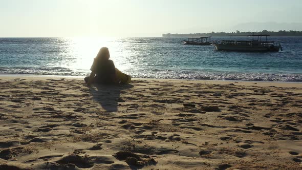 Beautiful fun woman on holiday by the sea on beach on summer white sand and blue background 4K