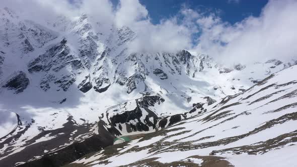 Flight above snowcapped mountains near Elbrus