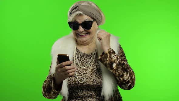 Elderly Stylish Trendy Caucasian Grandmother Woman Using Smartphone. Chroma Key