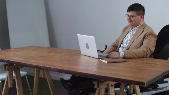 Businessman in Wheelchair Videocalling