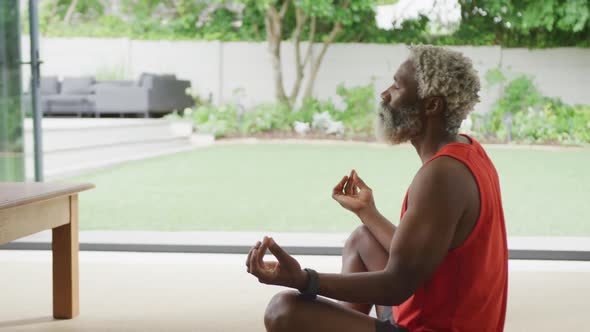 Video of african american senior man meditating