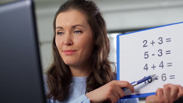 Math Teacher Having Online Class on Laptop at Home