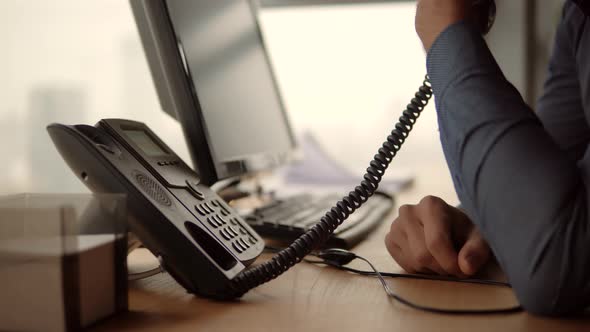 Businessman Talking On Phone In Office. Man Working In Office. Open Space Room. Work In Office