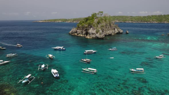 Aerial Drone Flight Over Catamarans Near Small Island at Bali Indonesia