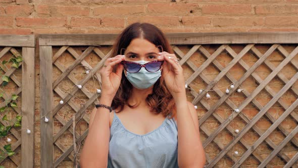 Tourist Using Medical Mask Protection to Protect Herself From Coronavirus and Covid19 During Travel