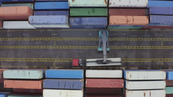 Loading Cargo Container on Transport Truck