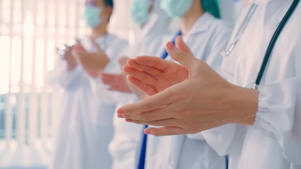Close up Group of Asian doctor and nurse clapping the hands with smile.