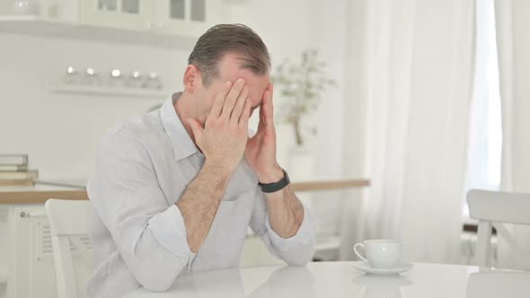 Stressed Middle Aged Man Getting Worried at Home