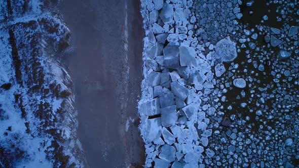 Aerial view of the frozen rocky sea on the coast of Muraste, Estonia.