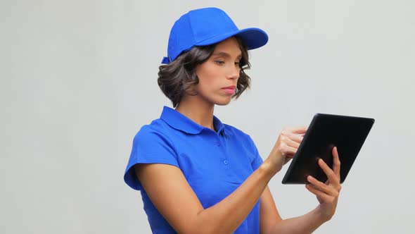 Delivery Girl in Blue Uniform with Tablet Computer