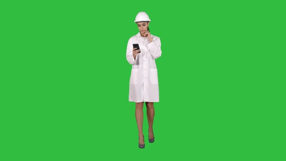 Scientist Using Phone Texting Message on a Green Screen