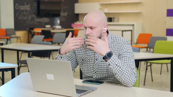 Teacher Who Teaches Online Lessons Sits in Front of the Computer