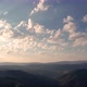 Aerial time lapse of morning clouds at sunrise, over hills - VideoHive Item for Sale