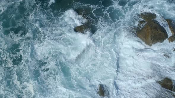 Waves Crashing Against a Rough and Rugged Coastline