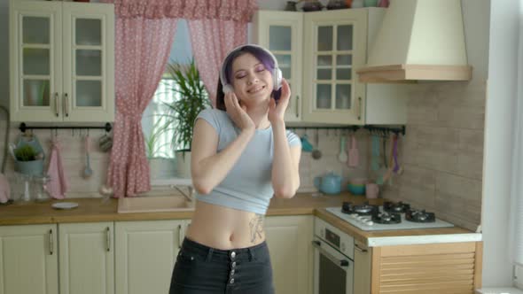 Young Beautiful Woman Dancing Kitchen At Home In Headphones