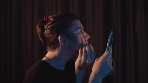 Drag Artist  Young Man Applying Light Concealer Under His New Drawn Eyebrows