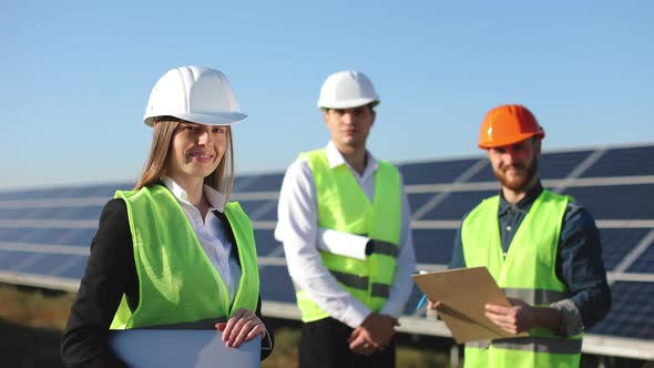 The Female Engineer is Standing and Looking at the Camera