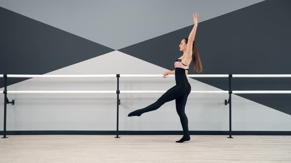 Female Dancer Training in Ballet Studio