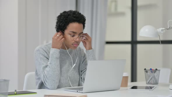 African Woman Meditating Listening To Music on Laptop 