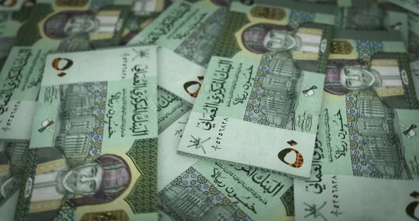 Oman Rial growing pile of money seamless loop