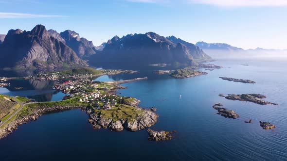 Flight over the sea and view on the fishing village Reine and Hamnoya ,Lofoten Islands,Norway