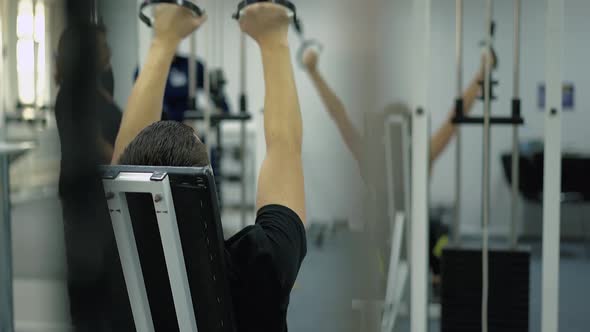 People Perform Exercises To Strengthen the Muscles of the Arms