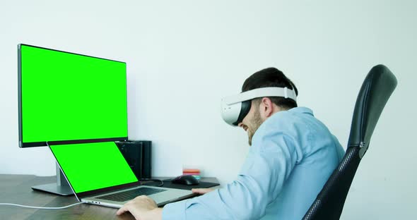 Man in Virtual 3d Glasses Working on Imaginary Display Day in Office