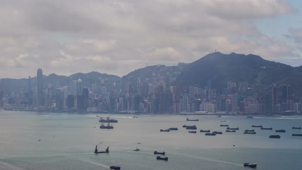 Timelapse Boats Sail on Sea Surface Against Hong Kong City