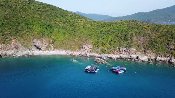 Drone View of Several Speedboats near Island in Snorkelling Spot.