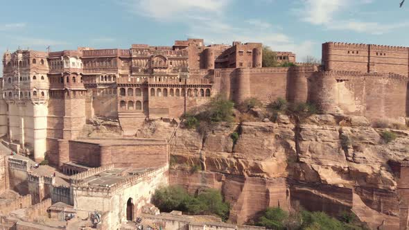 View of the majestic Mehrangarh Fort's facades and exterior walls surrounded by birds of prey, India