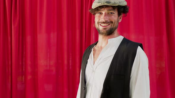 Circus artist with cap laughing happily