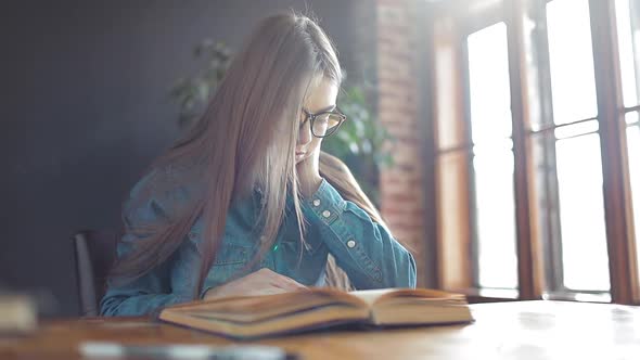 Young Student Reading the Book