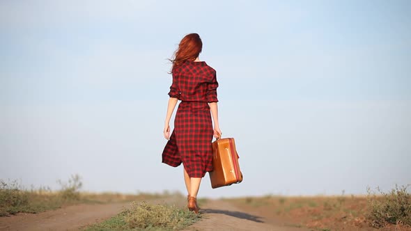 girl walking with travel suitcase