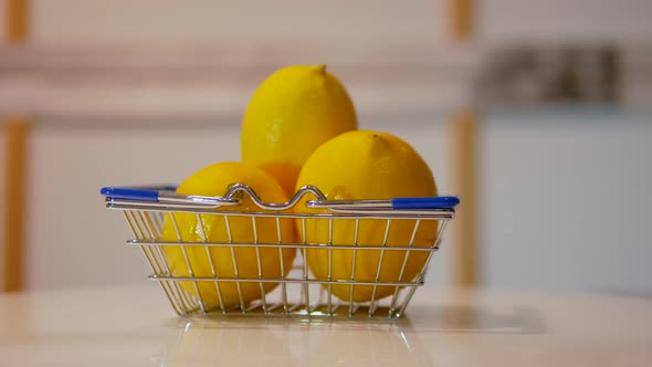 Ripe Peeled Lemons In A Grocery Cart. Lemons Are Spinning On The Table In A Cart From Supermarket