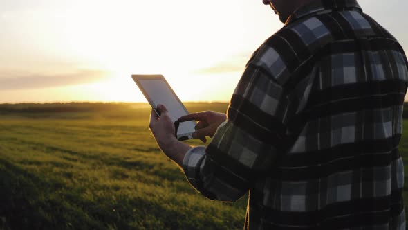 Smart Agriculture Technology Farmer Holding Tablet with Smart Technology