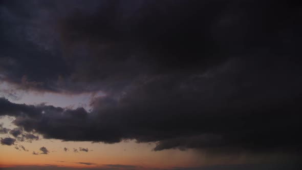 Blizzard Storm Sky on a Sunset Wi Cumulus Clouds and a Pouring Summer Rain in Slow Motion