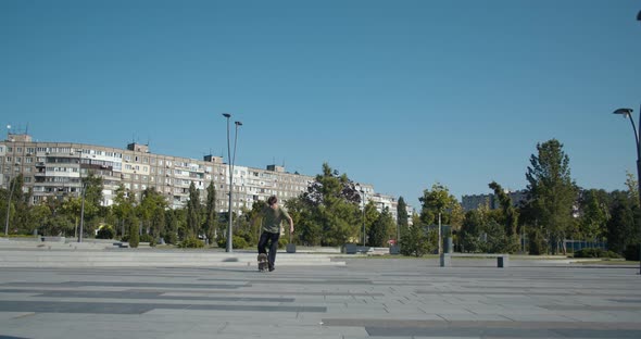 Quick Stop with a Turn By a Skater in a T-shirt, Sunny Day at the Skatepark, 