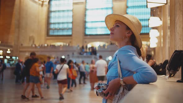 Young tourist with a retro camera