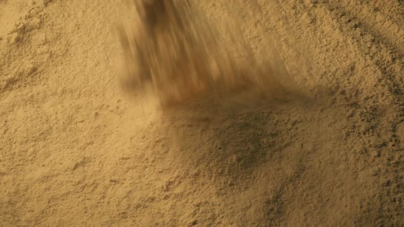 Spice Powder Pours Into Pile