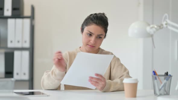 Indian Woman Reading Documents 