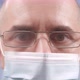 A Masked Doctor Wears Glasses - VideoHive Item for Sale