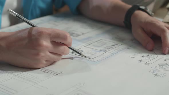 Close Up Of Hand's Man Engineer Drawing Blueprint alt
