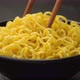 Instant noodles with chopsticks on black background, ProRes uncompressed - VideoHive Item for Sale