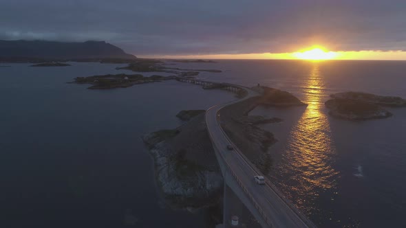 Atlantic Ocean Road in Norway at Sunset. Cars Are Passing on Storseisundet Bridge. Aerial View