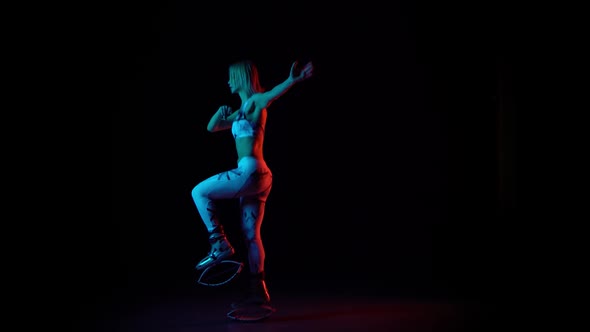 Woman Dancing in Kangoo Jumps Shoes at Studio