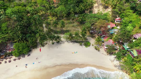 Aerial top view scenery of marine tourist beach lifestyle by blue water with white sandy background 