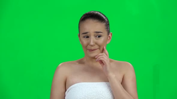 Girl in White Towel Looks Confused, Feeling Guilty Confused Says: Oops Sorry. Green Screen. Slow