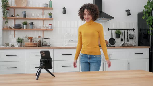 Woman Blogger Dancing on Smartphone Camera Recording Video for Social Media