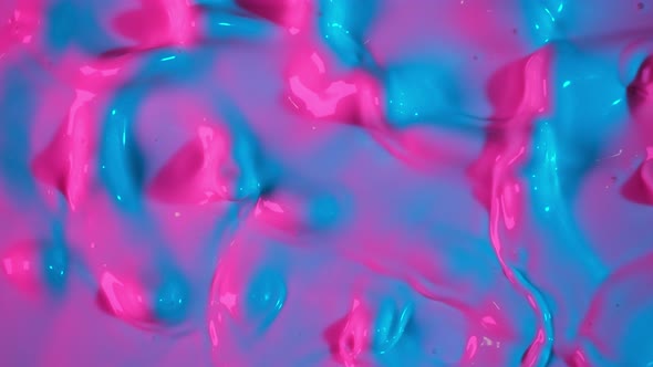 Super Slow Motion Abstract Shot of Swirling Neon Liquid at 1000Fps