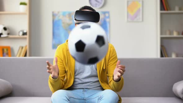 Young Afro-American Y in VR Headset Saving Goal, Pretending to Be Goalkeeper